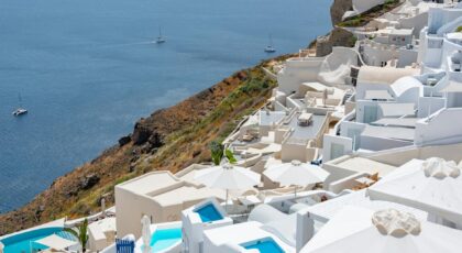 Stunning view of Santorini's white architecture with the Aegean Sea in the background. Perfect for travel enthusiasts.