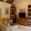 Warm and inviting living room in a Balinese villa featuring traditional decor.
