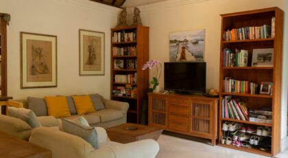 Warm and inviting living room in a Balinese villa featuring traditional decor.