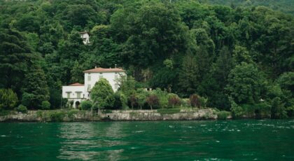 Charming villa by Lake Como surrounded by lush greenery in Lombardy, Italy.