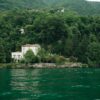 Charming villa by Lake Como surrounded by lush greenery in Lombardy, Italy.