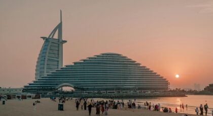 Capture of the Burj Al Arab and Jumeirah Beach during a breathtaking sunset in Dubai.