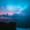 Experience the serene twilight sky over Bali's coastline, capturing a stunning blend of colors and peaceful ocean views.