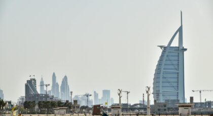 The iconic Burj Al Arab against the backdrop of Dubai's magnificent skyline, showcasing modern architecture.